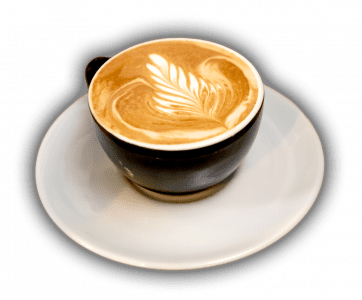 coffee cup on a plate with a design